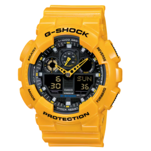 Casio G-Shock GA-100A-9A yellow resin analog-digital watch with black face Casio G-Shock GA-100A-9A case profile showing oversized anti-slip buttons Casio G-Shock GA-100A-9A three-dial face with analog hands and twin digital displays